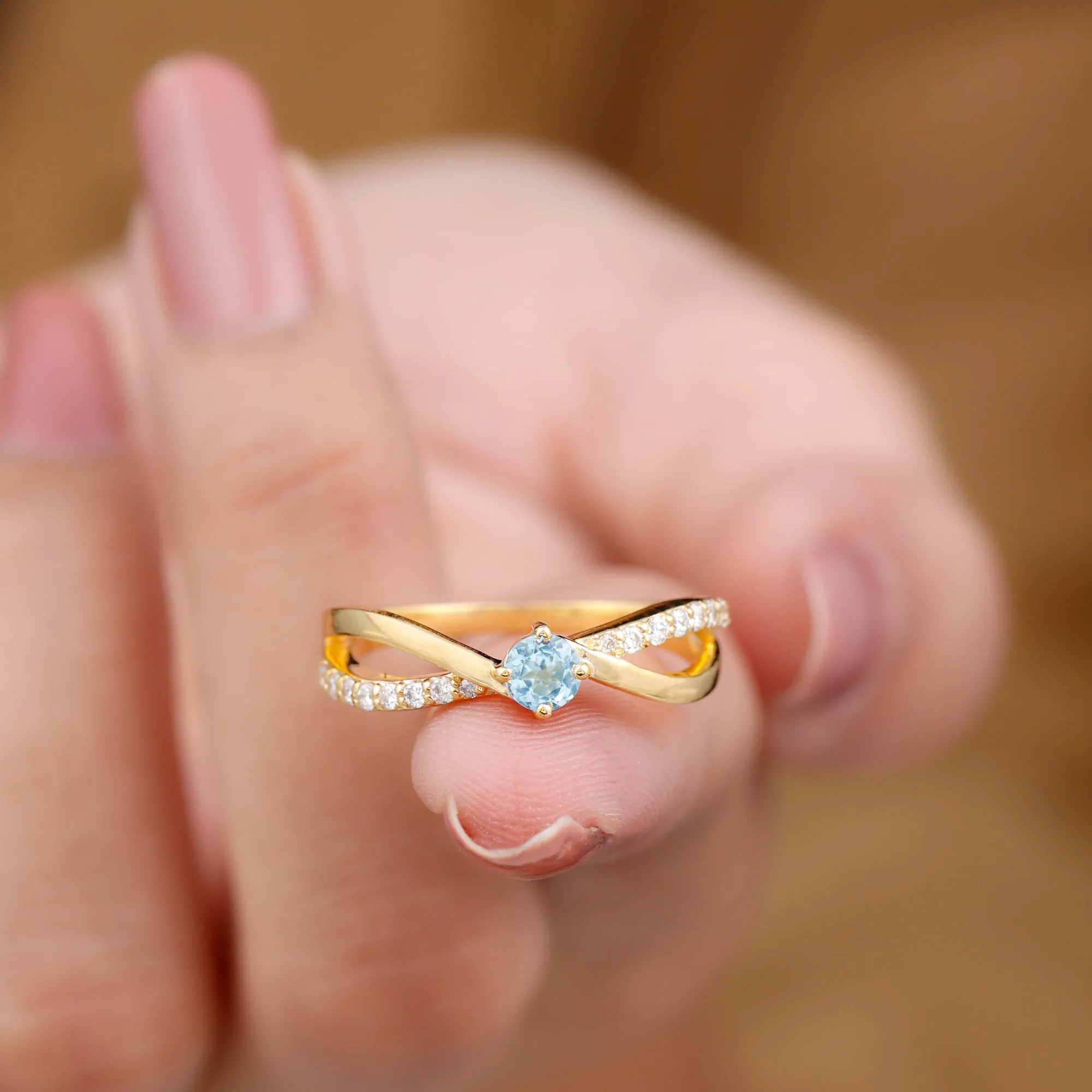 1/2 CT Sky Blue Topaz Solitaire and Diamond Gold Infinity Ring