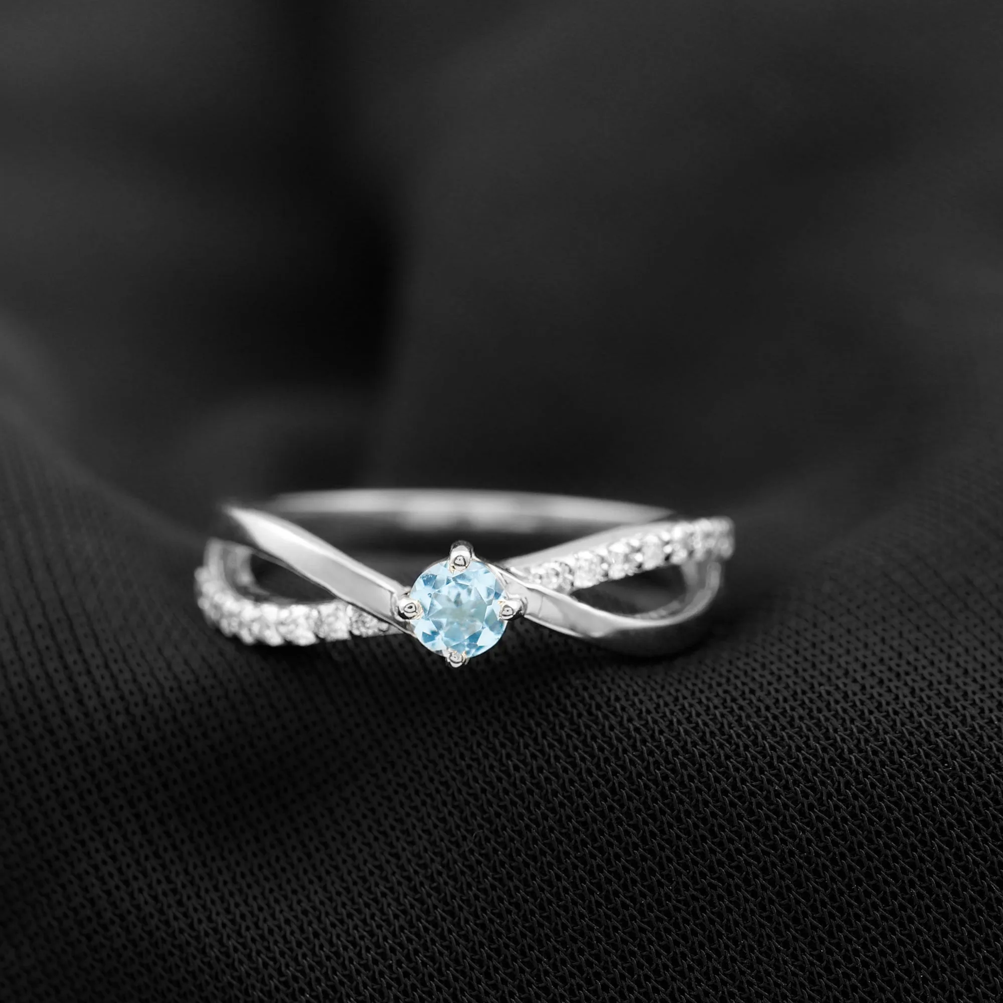 1/2 CT Sky Blue Topaz Solitaire and Diamond Gold Infinity Ring