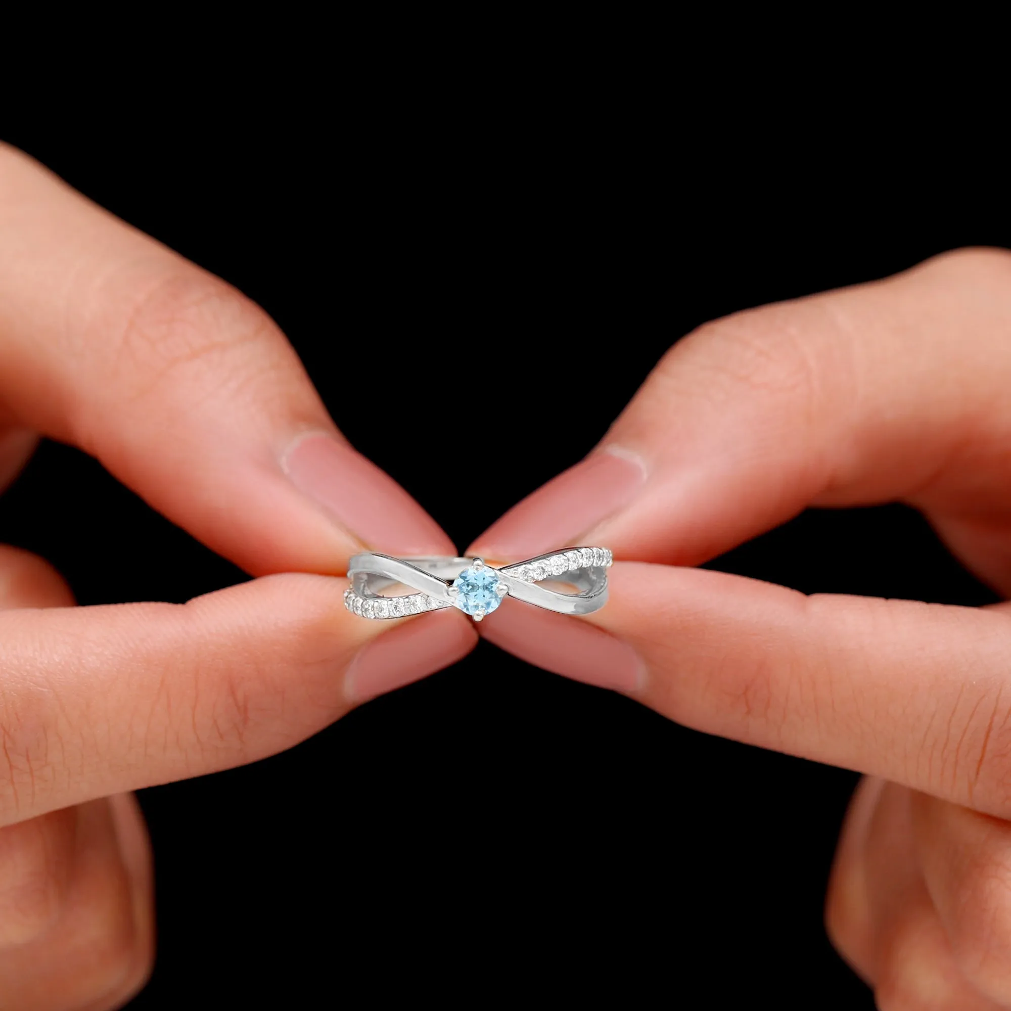 1/2 CT Sky Blue Topaz Solitaire and Diamond Gold Infinity Ring