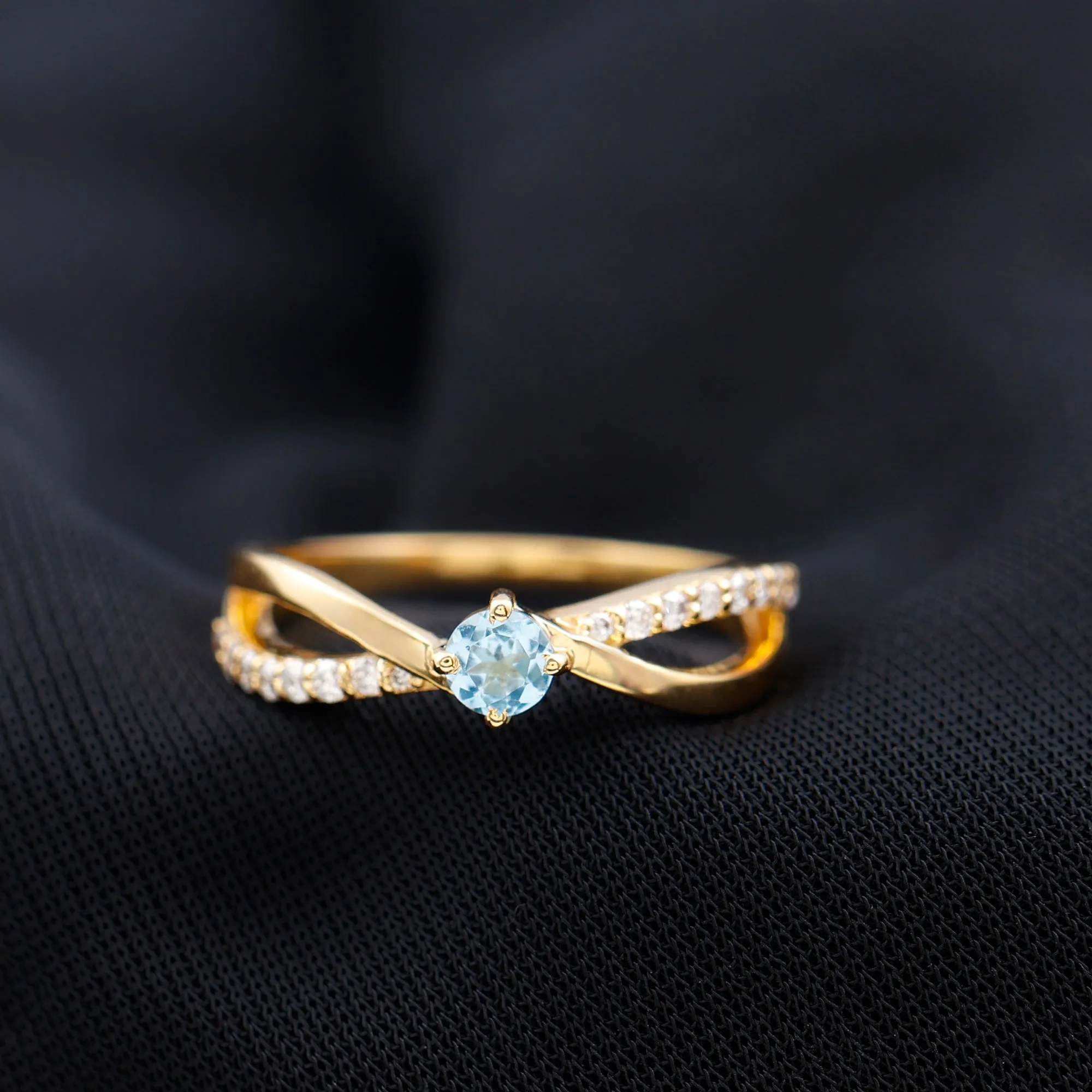 1/2 CT Sky Blue Topaz Solitaire and Diamond Gold Infinity Ring