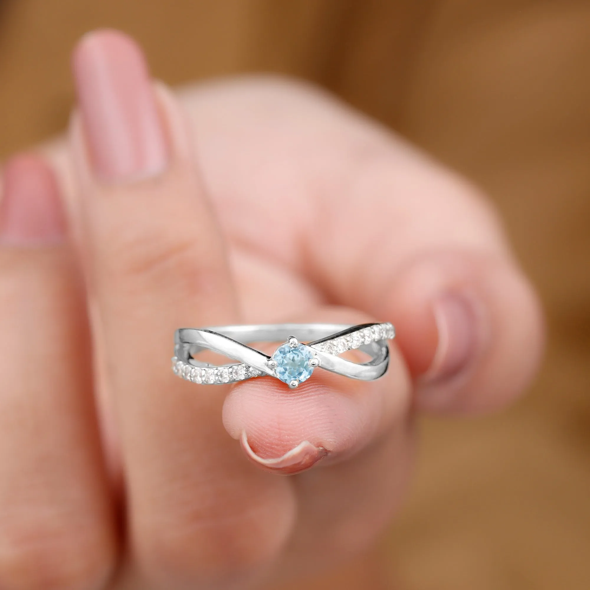 1/2 CT Sky Blue Topaz Solitaire and Diamond Gold Infinity Ring