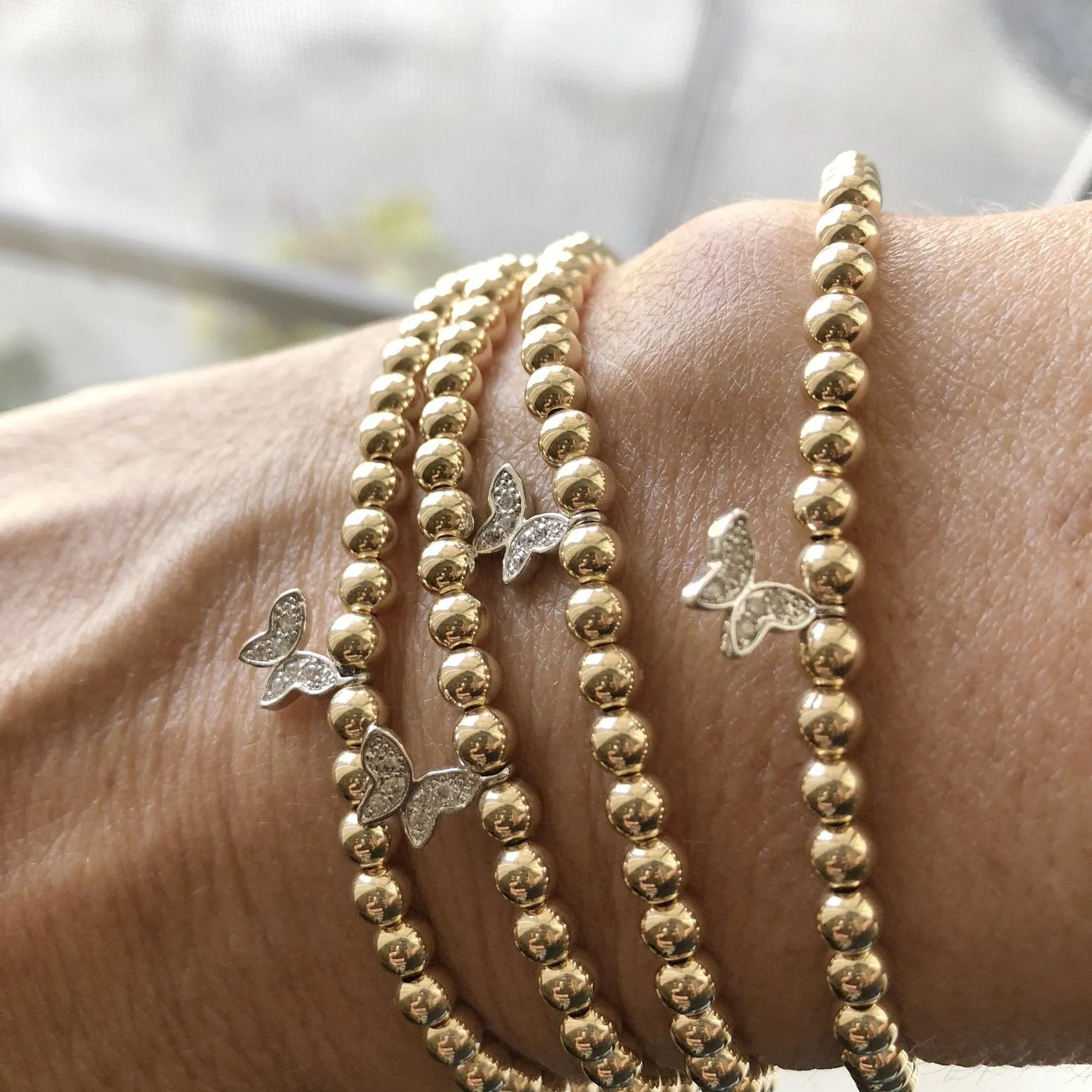 4mm Beaded Stretch Bracelet with Silver/Cubic Zirconia Butterfly Charm