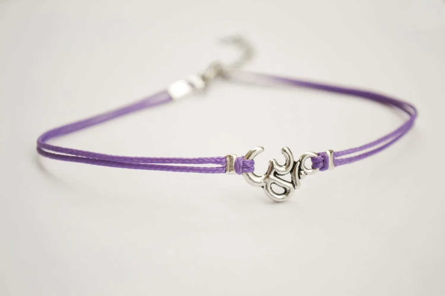 Purple bracelet with silver Om charm, yoga jewelry